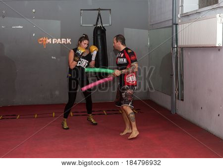 CRACOW POLAND - FEBRUARY 12 2016: Agnieszka Niestoj - talented Polish boxer durning boxing training with coach in the gym. Cracow Poland