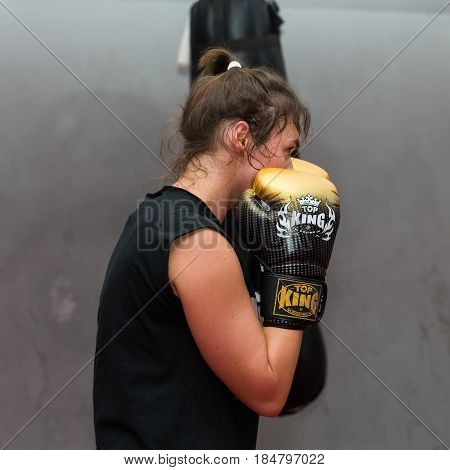 CRACOW POLAND - FEBRUARY 12 2016: Agnieszka Niestoj - talented Polish boxer durning boxing training with coach in the gym. Cracow Poland