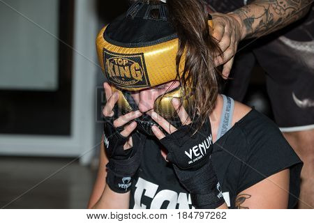 CRACOW POLAND - FEBRUARY 12 2016: Agnieszka Niestoj - talented Polish boxer durning boxing training with coach in the gym. Cracow Poland