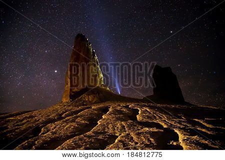Rocks and cliffs in the desert canyon of Boszhira on background of the starry sky, chines of Ustyurt, Kazakhstan