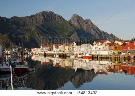 Norwegian village under mountains - in the mirror