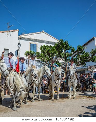Sent-Mari-de-la-Mer, Provence, France - May 25, 2015.  The concept of ethnographic tourism. World Festival of Gypsies. Convoy - guards on white horses before the start of the parade