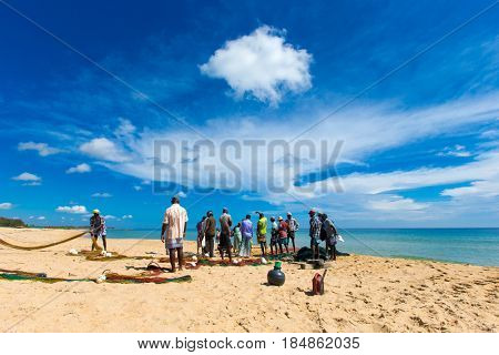 SRI LANKA - Mach 23: Local fishermen pull a fishing net from Indian Ocean on Mach 23, 2017 in Kosgoda, Sri Lanka. Fishing in Sri Lanka is the way they earn their living.