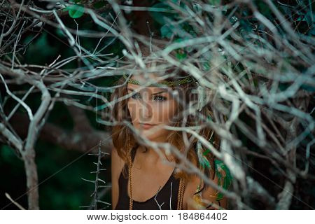 beautiful young woman witch in mystery forest