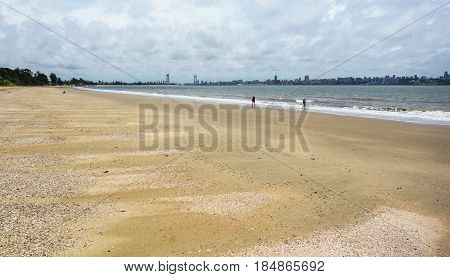 People walking on Catembe beach towards Maputo City