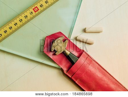 glass and glass cutter closeup on wooden background