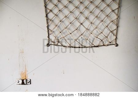 Old bagage net on wall of train.