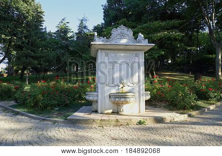 The ottoman style fountain and the rose garden in the Gulhane Park. Gulhane Park (Rosehouse Park) is a historical urban park in the Eminonu district next to the Topkapi Palace in Istanbul. Turkey.
