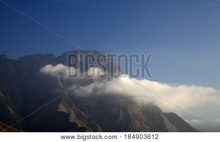 Gran Canaria cliff Risco Faneque with a little cloud in front of it