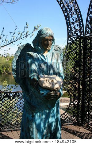 Buki temple complex landscape park. A statue of an angel with a stone was brought from Israel from the place where Jesus turned water into wine