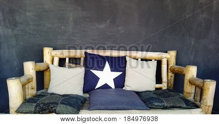 Picture of seating furniture with decorative pillows.