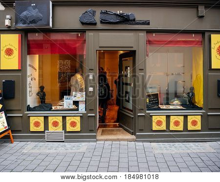STRASBOURG FRANCE - APR 27 2017: Queue at the newly opened belgian waffle store cafe in cetral Strasbourg - les gaufres belges une fois have some of the most delicious waffles