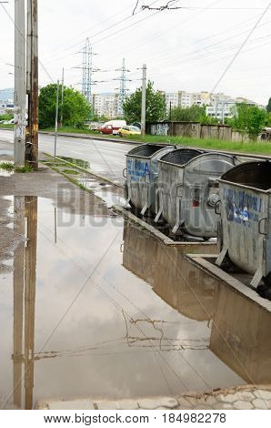 Reflection In Large Puddle On An Overcast Day