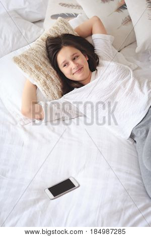 girl became a woman concept - young girl lying with period pain