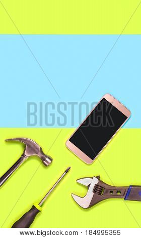 Vertical mobile phone repair background or template for smartphone fixing company's advertisement in print. Blank empty copy space for text and content. Cellphone and tools on green and blue texture.