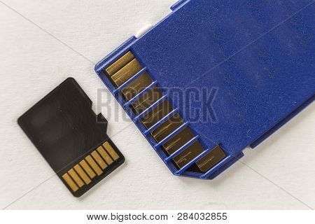 Close-up Of Micro Sd Memory Card And Sd Adapter Isolated On White Copy Space Background. Modern Tech