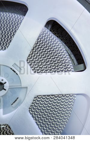 Reel Of Electronic Smd Components Placed Together With Different Sizes Tapes. Vertical Image