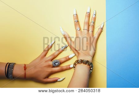 Woman Hands Holding Colorful Paper Copyspace Wearing A Lot Of Jewelry And Long Nails