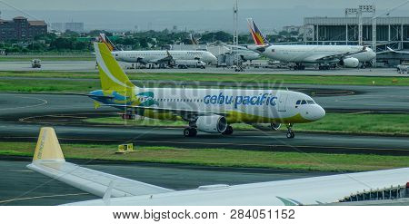 Passenger Airplane At Manila Airport, Philippines