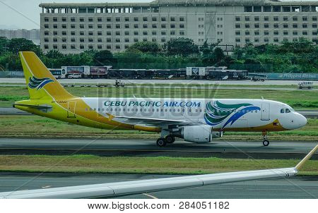 Passenger Airplane At Manila Airport, Philippines