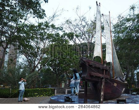 Tangerang, Indonesia - October 19, 2018: A Family Taking Photos In Front Of The Phinisi Boat Replica