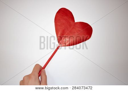 Handmade Red Paper Heart On The Red Stick Held By Woman Hand
