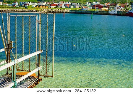 Fishing Port Old Pier And Gate With Bleik Village Houses In The Background. Andoya Island, Vesterale