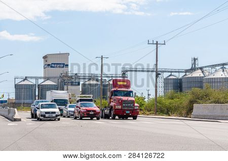 Kingston/saint Andrew, Jamaica - February 05 2019: Beyond The Vehicles Is Newport Mills Limited, A M