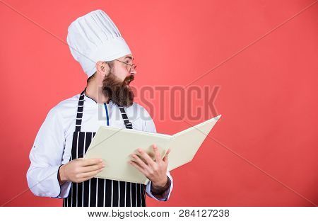 Book Recipes. According To Recipe. Man Bearded Chef Cooking Food. Culinary Arts Concept. Amateur Coo