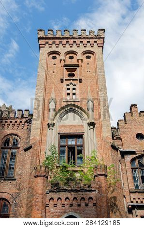 The Ancient Palace In The Gothic Style Against The Sky With Clouds In Manor  Dakhovsky, Leskovo, Che