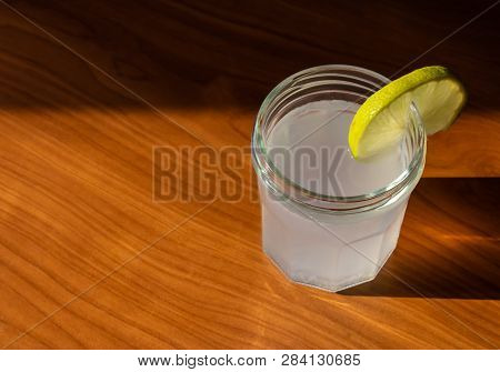 The Glass Of Lemon Juice With The Slice Of Lemon