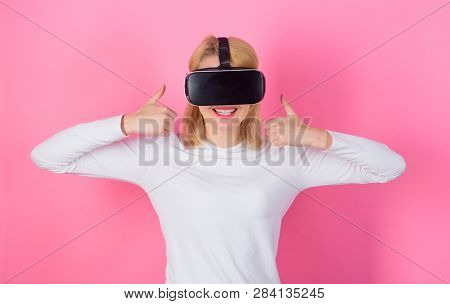 Young Woman Using A Virtual Reality Headset. Woman Using Vr Device. Confident Young Woman Adjusting 