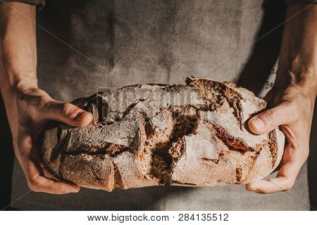 Baker Or Chef Holding Fresh Made Bread