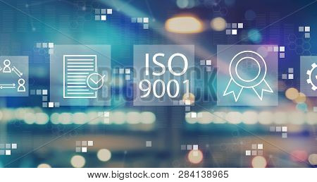 Iso 9001 With Blurred City Abstract Lights Background