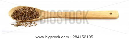 Fenugreek Seeds In A Wooden Spoon. Isolated On White Background. Place For Writing.