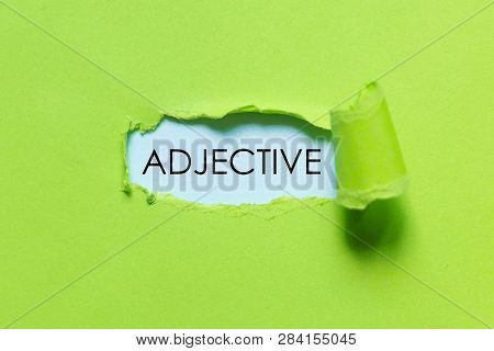 Ufo Green Torn Paper Written With Adjective.