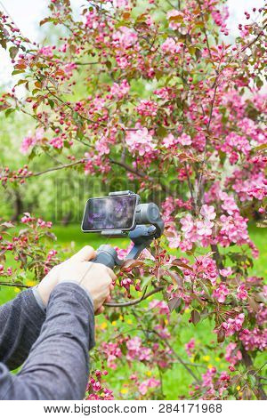 Russia, Moscow - May 13, 2018: Close-up Of Man Blogger Hands Shooting Video On Smartphone Iphonex Us
