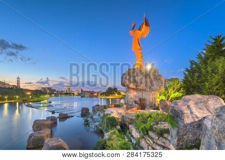 WICHITA, KANSAS - AUGUS 31, 2018: The confluence of the Arkansas and Little Arkansas River at the Keeper of the Plains near downtown Wichita at dawn. 
