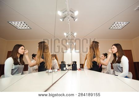 Make-up Artist Doing Professional Make-up Of Young Woman.