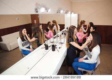 Make-up Artist Doing Professional Make-up Of Young Woman.