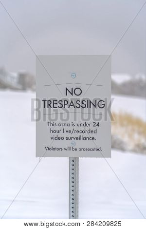 No Trespassing Sign Against A Snowy Landscape