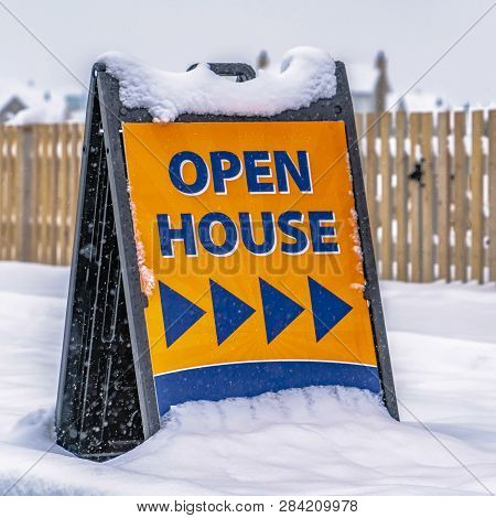 Open House Sign In Front Of A Real Estate For Sale