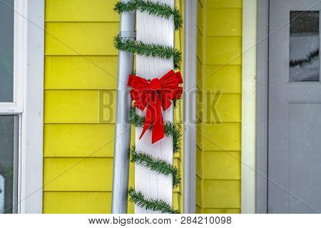 Porch Pillar With Holiday Decorations In Daybreak