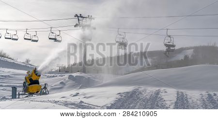 Sunny Day In Utah With Snow Cannons And Ski Lifts