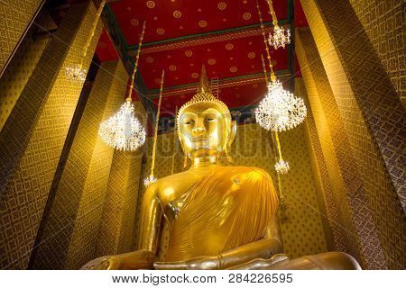 Golden Buddha Statue In Thai Buddhist Temple At Kalayanamitr Temple, Bangkok Thailand