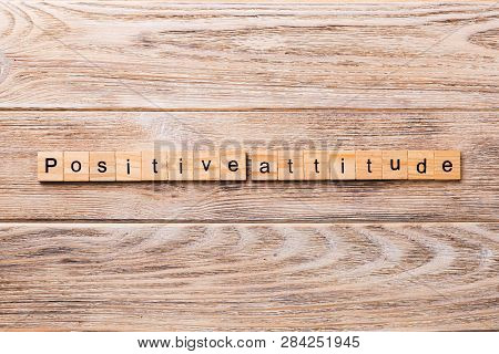 Positive Attitude Word Written On Wood Block. Positive Attitude Text On Wooden Table For Your Desing