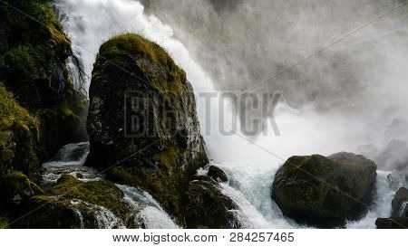 Panoramic View To Kleivafossen Waterfall On Briksdalselva River, Briksdalsbreen Glacier, Norway