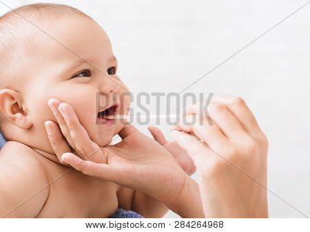 Pediatric Dentistry. Dentist Examining Little Babys Mouth. Oral Health And Hygiene From Born, Empty 