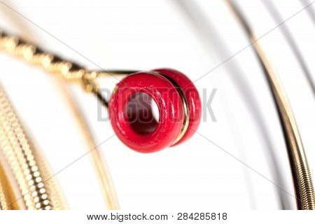 Strings For Guitar Isolated On A White Background. Macro