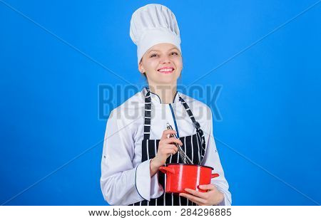 Woman Professional Chef Hold Whisk And Pot. Whipping Like Pro. Girl In Apron Whipping Eggs Or Cream.
